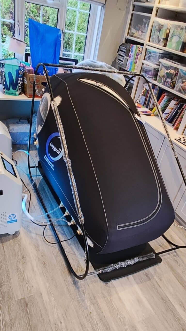 Space-saving Oxygens Sit-Up hyperbaric chamber installed in a combined study and playroom in Essex